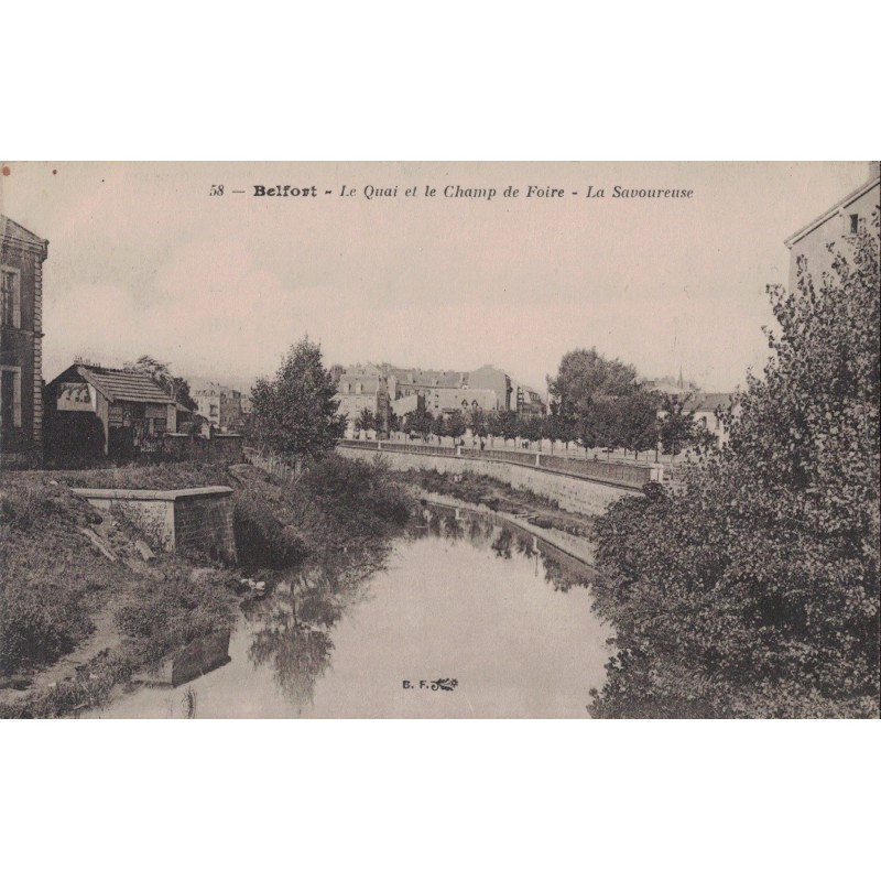 BELFORT - LE QUAI ET LE CHAMP DE FOIRE - LA SAVOUREUSE - CARTE DATEE DE 1920.